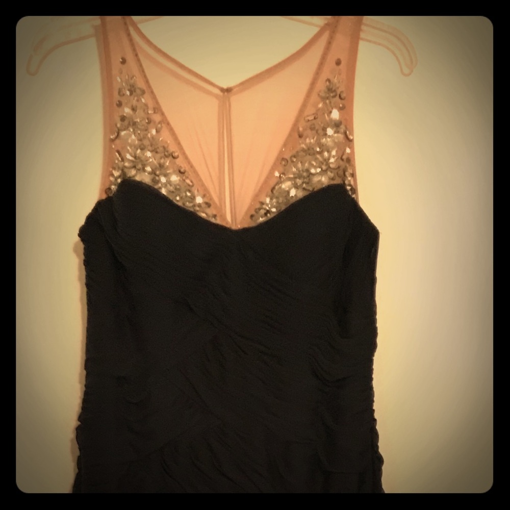Formal dark navy evening gown with beading in front.
